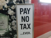 Pay No Tax Ever sign, duty free, sign, Pearson Airport T3, Toronto, ON, Canada by Cory Doctorow (CC BY-SA 2.0) https://flic.kr/p/nuuRgK