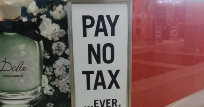 Pay No Tax Ever sign, duty free, sign, Pearson Airport T3, Toronto, ON, Canada by Cory Doctorow (CC BY-SA 2.0) https://flic.kr/p/nuuRgK