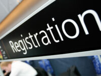 Registration desk sign by NHS Confederation (CC BY 2.0) https://flic.kr/p/9YxwXp