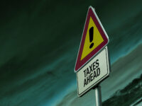 Warning sign of 'Taxes Ahead' by EFile989 http://www.efile.com/ (CC BY-SA 2.0) https://flic.kr/p/mnkQsH