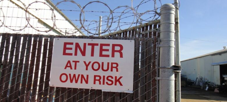 Barbed Wire Cyclone Fence Sign, Enter At Your Own Risk by Lynn Friedman (CC BY-NC-ND 2.0) https://flic.kr/p/9cY2Vt