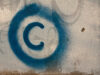 Large copyright graffiti sign on cream colored wall by Old Photo Profile (CC BY 2.0) https://flic.kr/p/7vBD4T
