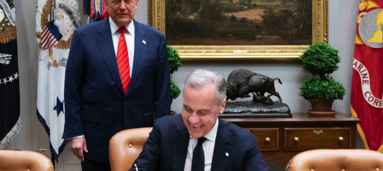 Washington, D.C., United States of America, May 6, 2025 - Prime Minister Mark Carney signs the White House guest book as President Donald J. Trump stands behind him.Photo: Lars Hagberg, https://www.pm.gc.ca/