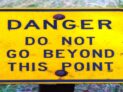 Danger Do Not Go Beyond This Point Sign by Rick Obst, CC BY 2.0 , via Wikimedia Commons