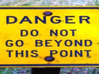 Danger Do Not Go Beyond This Point Sign by Rick Obst, CC BY 2.0 , via Wikimedia Commons