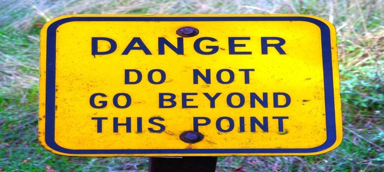 Danger Do Not Go Beyond This Point Sign by Rick Obst, CC BY 2.0 , via Wikimedia Commons