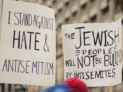 Group of people holding signs in the street by Levi Meir Clancy, Unsplash licence, https://unsplash.com/@levimeirclancy